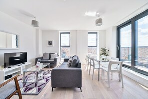 Apartment, 4 Bedrooms | Living area | 40-inch Smart TV with digital channels, iPod dock - Roomspace Apartments -Caroline Street (London)