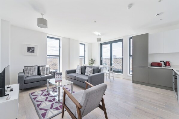 Apartment, 4 Bedrooms | Living area | 40-inch Smart TV with digital channels, iPod dock