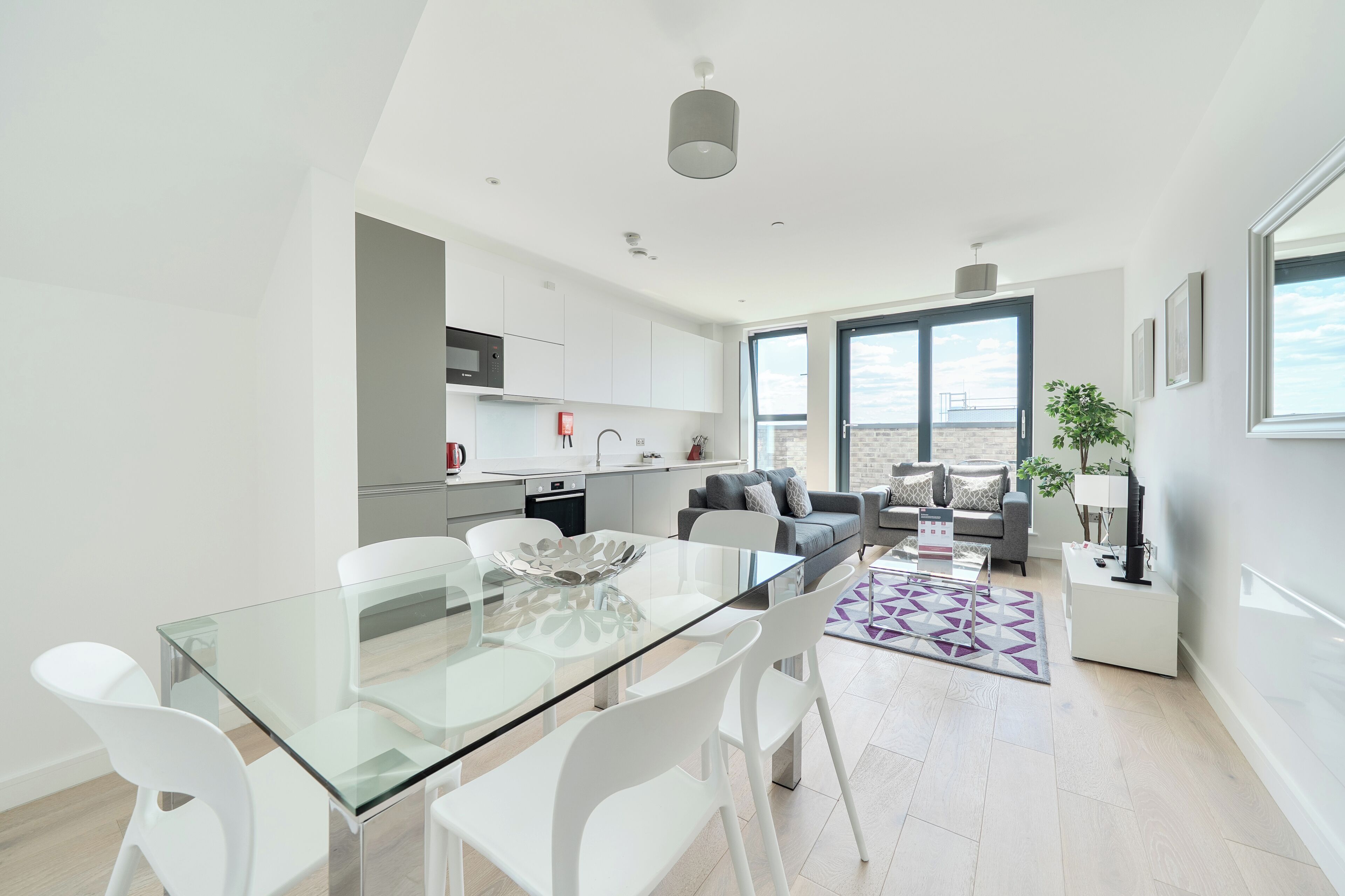 Apartment, 3 Bedrooms | Living area | 40-inch Smart TV with digital channels, iPod dock