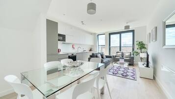 Apartment, 3 Bedrooms | Living area | 40-inch Smart TV with digital channels, iPod dock