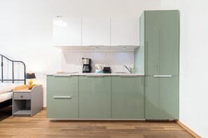 Fridge, microwave, stovetop, coffee/tea maker
