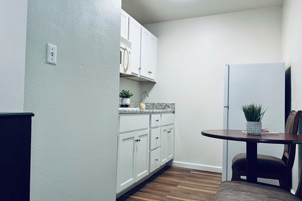 Mini-fridge, microwave, stovetop, cookware/dishes/utensils