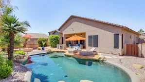 A backyard with a swimming pool, outdoor seating, and a house. - Peoria Desert Oasis < 10 Mi to Spring Training! (Peoria)