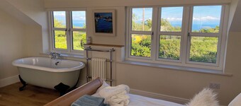 Delightful 3 bed cottage with hot tub, wood burning stove and sea views