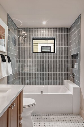 Shower, hair dryer, towels, shampoo