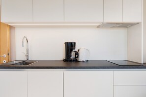 Fridge, stovetop, coffee/tea maker, electric kettle