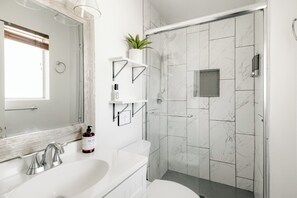 Shower, hair dryer, towels, soap