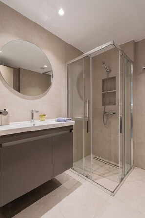 Shower, hair dryer, towels, soap
