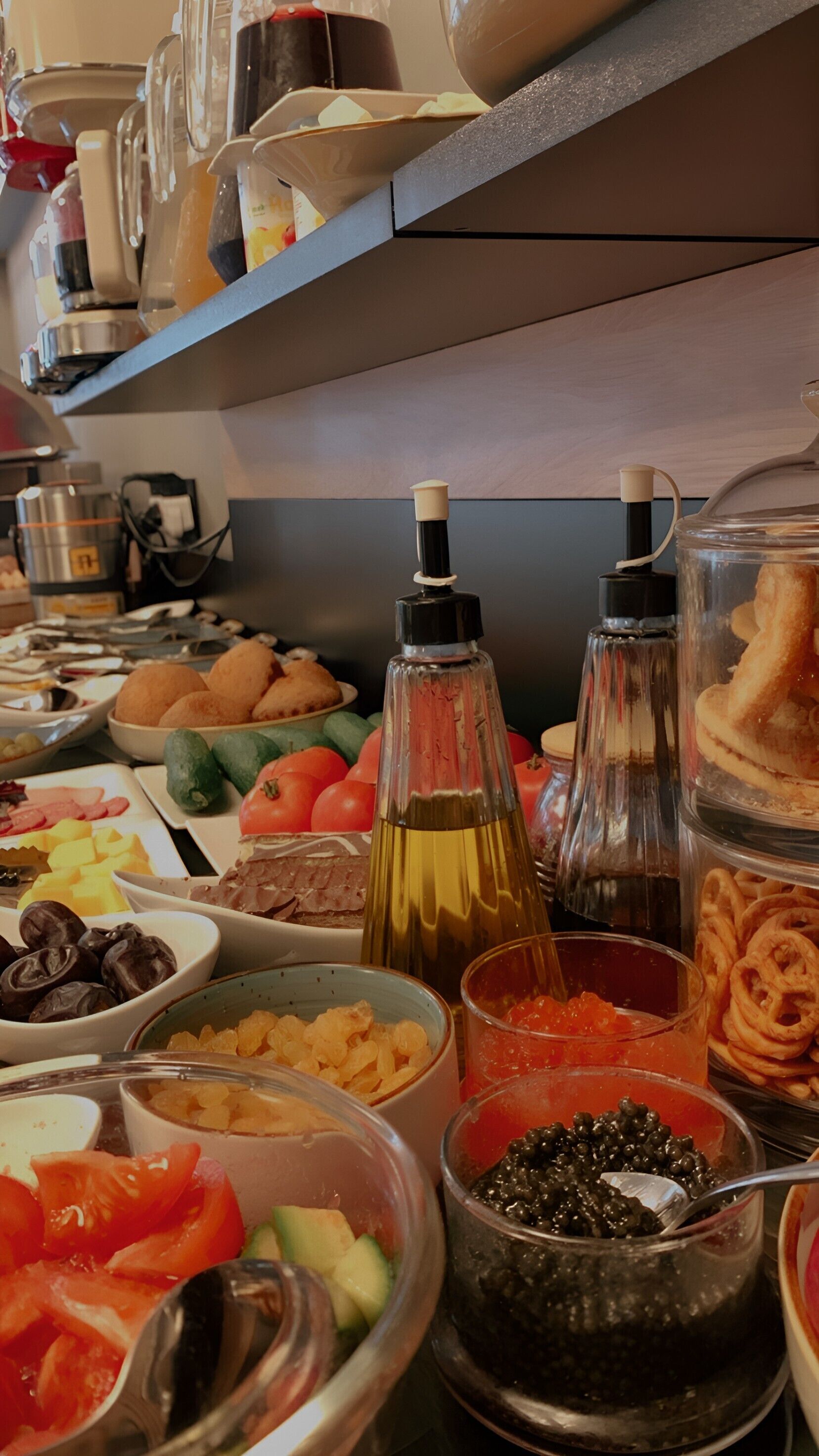 A buffet with various food items and condiments.