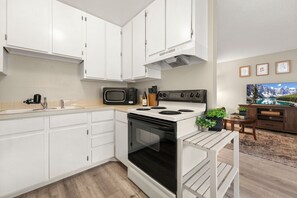 Apartment, Multiple Beds, Patio (Campus West Nest) | Private kitchen | Fridge, microwave, oven, stovetop - Campus West Nest - King Bed + Walk to CSU (Fort Collins)