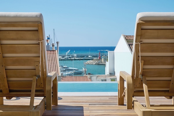 Seasonal outdoor pool, open 10:00 AM to 8:30 PM, pool umbrellas