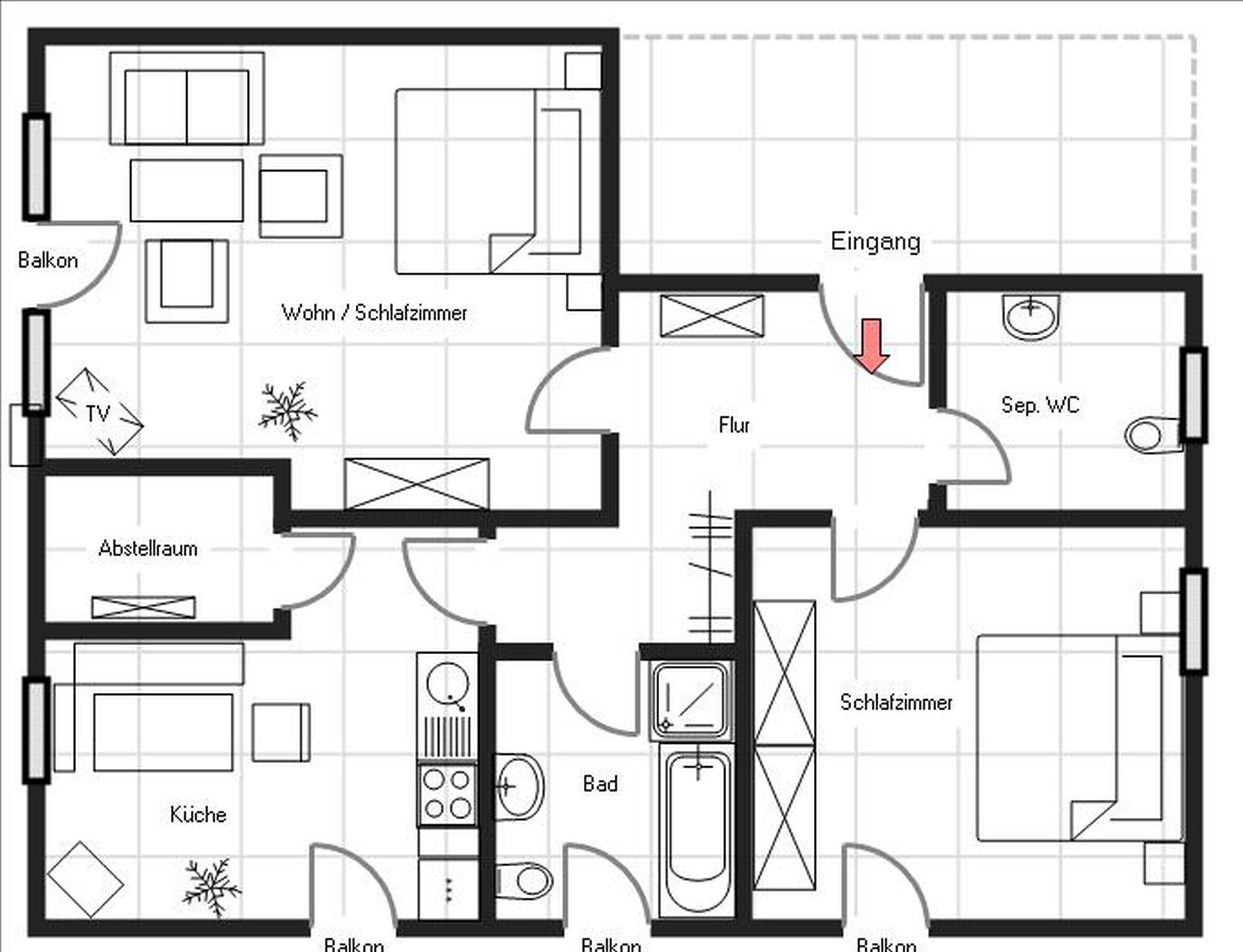 Ein Grundriss mit Küche, zwei Schlafzimmern, einem Badezimmer, einem Balkon und einem Wohnbereich.