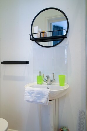 Hair dryer, towels, soap, toilet paper