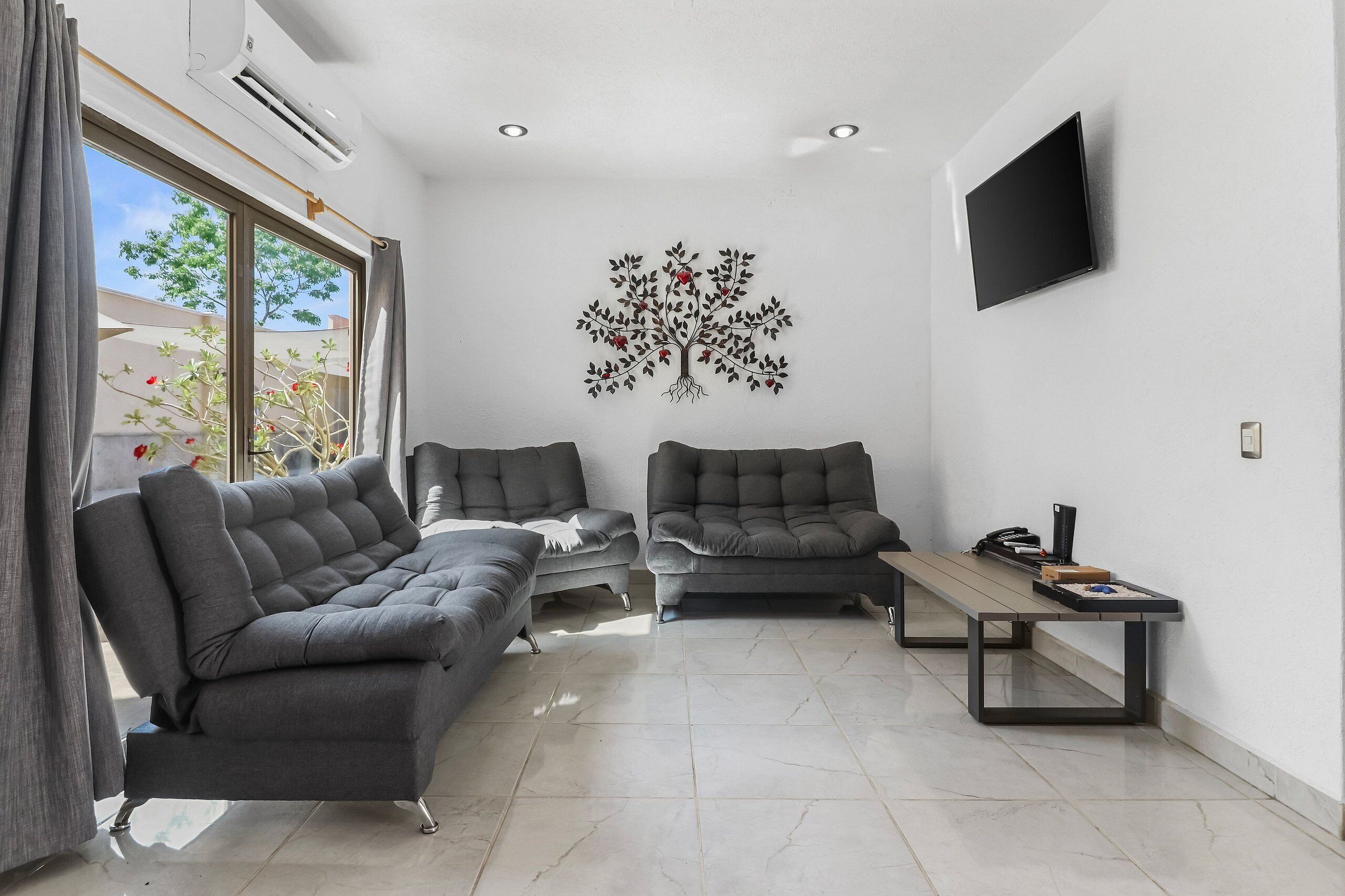 Villa | Living area | 45-inch LED TV with cable channels