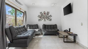 Villa | Living area | 45-inch LED TV with cable channels