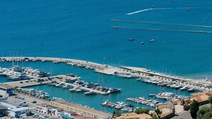 A marina with boats docked, a pier, and buildings in the background. - WELCS APARTMENT 273 EMP with public swimming pool (Rosas / Roses)