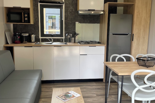 Quadruple Room, Park View | Living area | TV