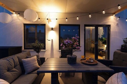 Earthy Ground Floor Home Patio Sunbeds Greenery