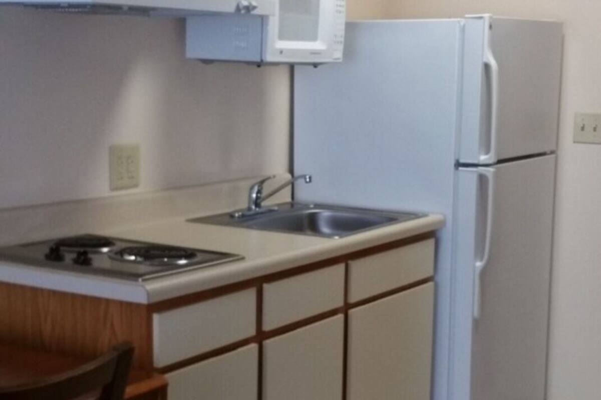 Mini-fridge, microwave, stovetop, cookware/dishes/utensils