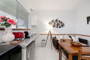Microwave, coffee/tea maker, toaster, cookware/dishes/utensils
