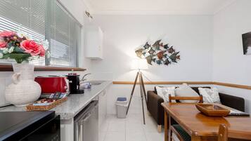 Microwave, coffee/tea maker, toaster, cookware/dishes/utensils