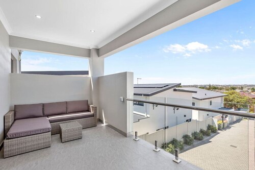Stylish urban oasis with balcony & street views!