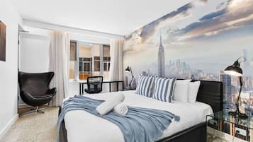 1 bedroom, desk, iron/ironing board, travel crib