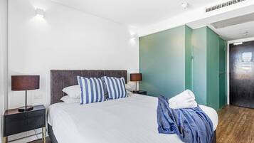 1 bedroom, desk, iron/ironing board, travel crib