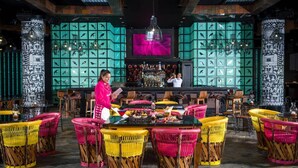 A restaurant with wicker chairs, a bar area, and decorative fish wall panels. - Charming 2-bedroom Suite with fitness room and AC in gorgeous Nuevo Vallarta (Nuevo Vallarta)