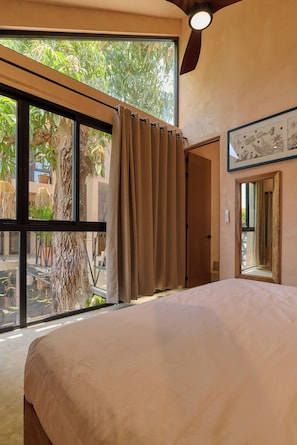Deluxe Suite, 1 King Bed, Pool View | Minibar, in-room safe, iron/ironing board, free WiFi