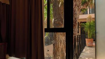 Deluxe Suite, 1 King Bed, Pool View | Minibar, in-room safe, iron/ironing board, free WiFi