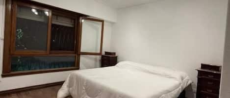 Basic Room, 1 King Bed, Shared Bathroom, Pool View | Iron/ironing board, free WiFi, bed sheets
