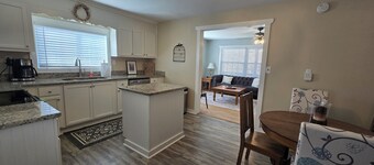 Charming Mountain Retreat with fire pit, fenced yard, scenic views, and privacy.