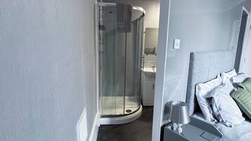 Deluxe Double Room, Private Bathroom | Bathroom | Shower, hair dryer, towels, soap