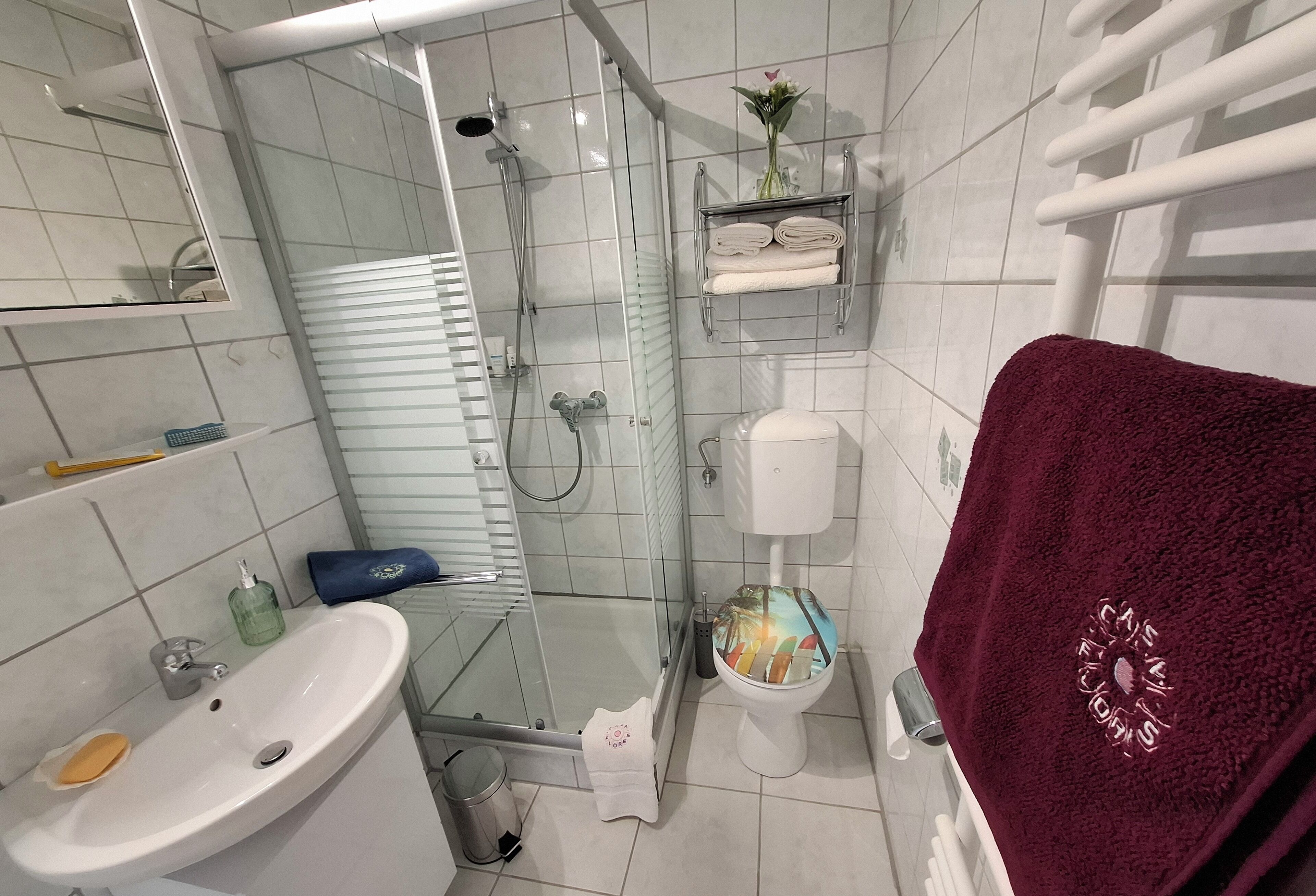 Shower, hair dryer, towels, soap