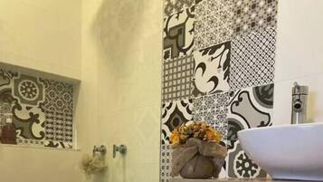 Shower, towels, soap, toilet paper