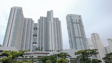 A high-rise building with multiple floors, large windows, and a modern architectural design.