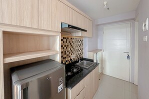 Standard Apartment | Private kitchen - Strategic Spot Studio With Mall Access At Tanglin Supermall Mansion Apartment (Surabaya)