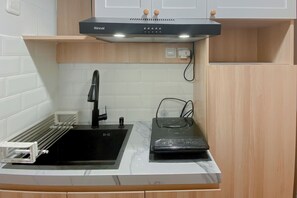 Standard Apartment | Private kitchen - Minimalist And Homey Studio Apartment At The Alton (Semarang)