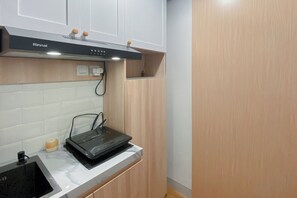 Standard Apartment | Private kitchen - Minimalist And Homey Studio Apartment At The Alton (Semarang)