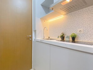 Standard Apartment | Private kitchen - Warm Studio At Tifolia Apartment (Jakarta)