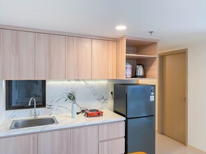 Standard Apartment | Private kitchen - Restful 3Br At Meikarta Apartment (Cikarang)