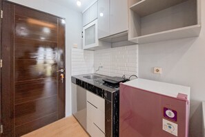 Standard Apartment | Private kitchen - Modern Chic Studio At Sky View Apartment (South Tangerang)