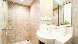 A modern bathroom with a shower, sink, and mirror. - Modern Minimalist Studio (No Kitchen) At Great Western Apartment (Tangerang)