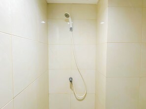 Standard Apartment | Bathroom - Simple Blue Toned Studio (No Kitchen) At Elvis Tower Apartment (Cikarang)