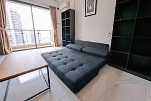 Standard Apartment | Living area - Monochromatic 2Br With Extra Working Room Apartment Sky House Bsd (Pagedangan)