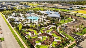 An aerial view of a resort with a swimming pool, landscaped areas, and a parking lot. - 10 BD/ 8 BA/ Windsor Cay (16199 CC) (Clermont)
