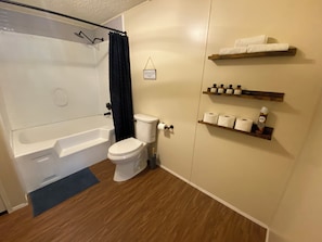 Jetted bath, hair dryer, towels, soap