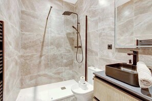 Shower, hair dryer, towels