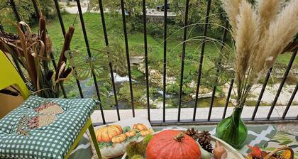 Cozy family home with terraces on the river, surrounded by greenery